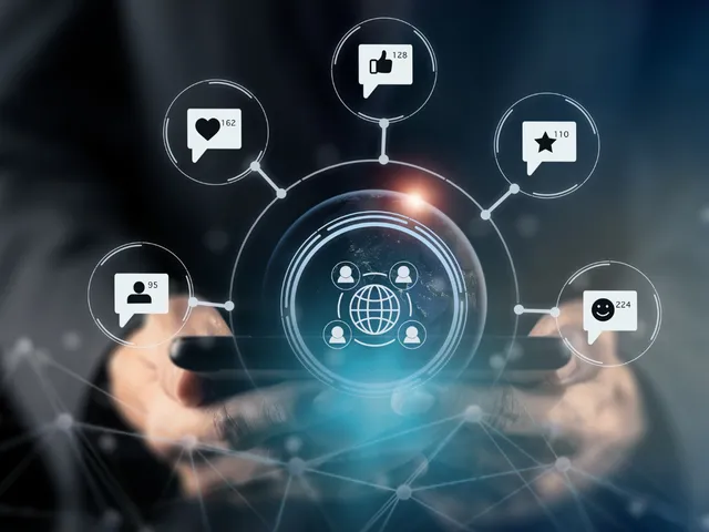 Automated training communication shown as a graphic, a hand holding expanding communication, email, and sms symbols
