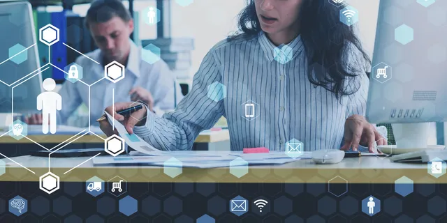 Professional woman reviewing documents at a desk, overlaid with digital icons representing business connectivity and logistics.
