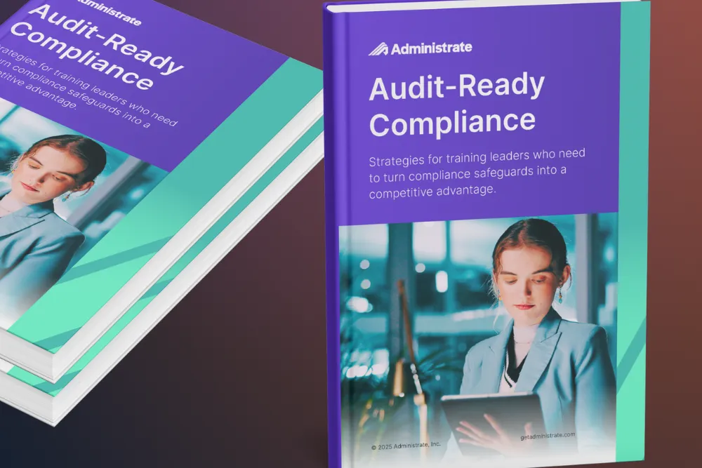 Two copies of the Administrate Audit-Ready Compliance ebook displayed at an angle.