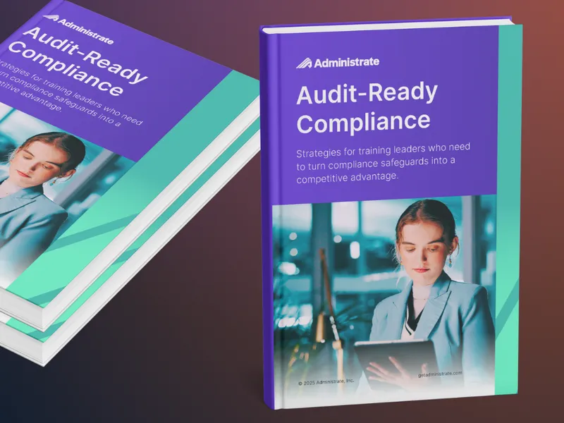 Two copies of the Administrate Audit-Ready Compliance ebook displayed at an angle.