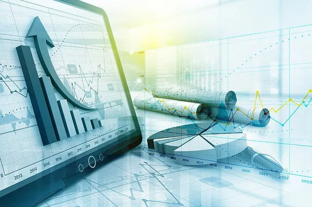 A teal-tinted composite illustration of overlapping business charts, line graphs, bar graphs, and rolled-up financial reports.