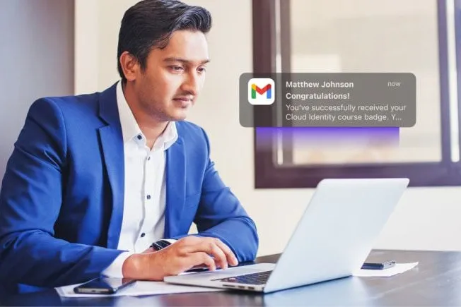 Training professional looks at a digital badge earned from Administrate, delivered to his Gmail inbox.