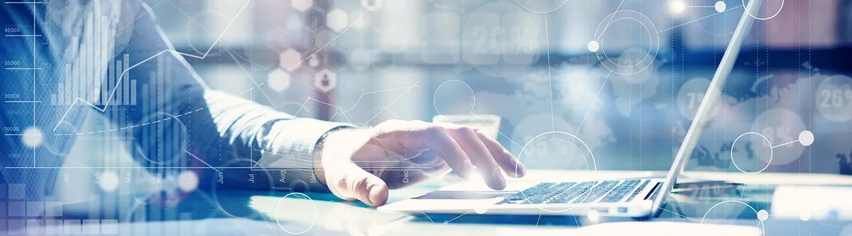 Business analyst working on a laptop overlaid with digital data visualizations including line graphs, bar charts, and network nodes.