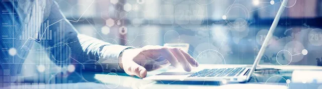 Business analyst working on a laptop overlaid with digital data visualizations including line graphs, bar charts, and network nodes.