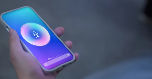 Person holding a phone while speaking into an AI chatbot.